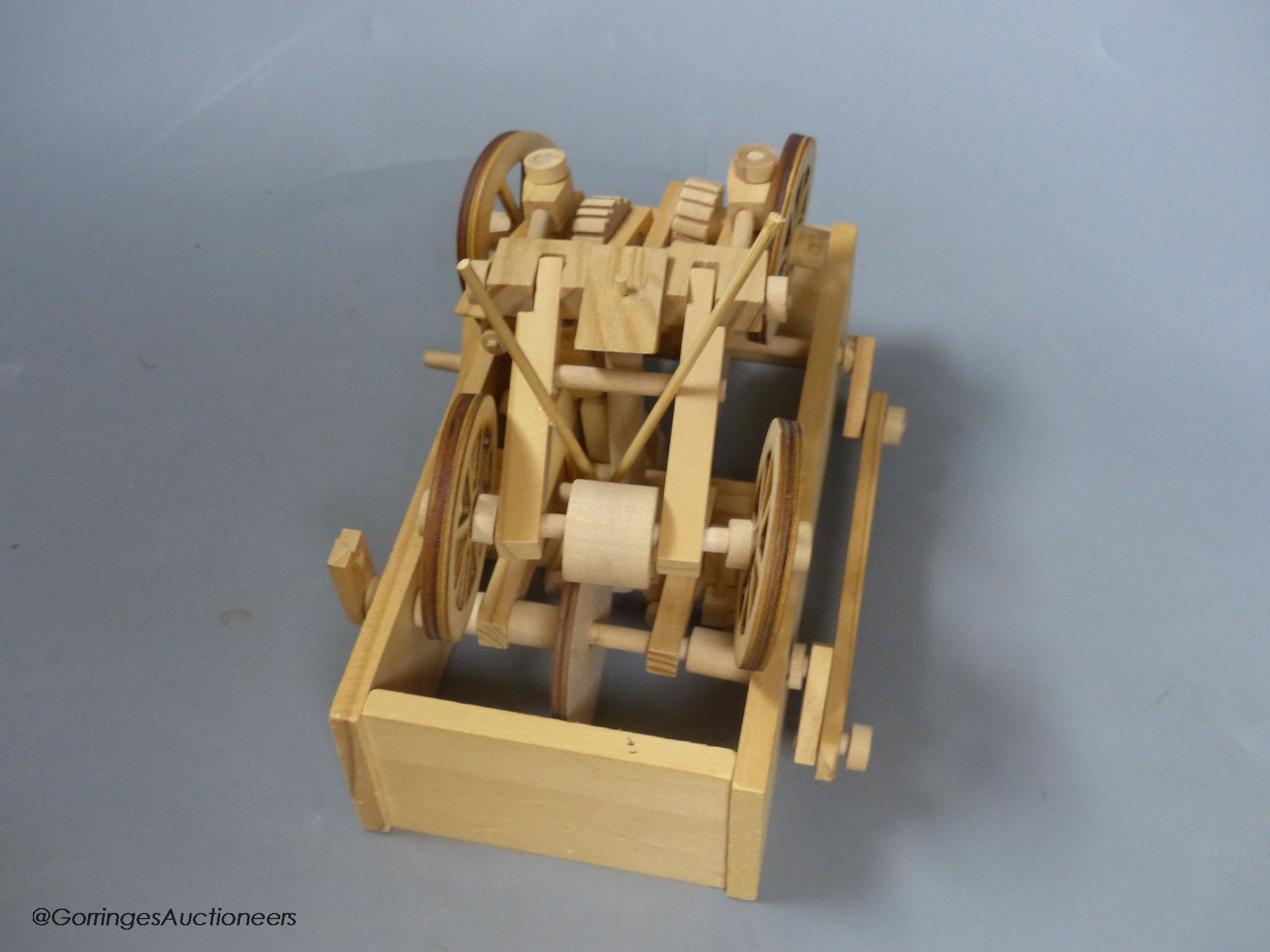 Two modern lightwood mechanical veteran motor cars, and a three masted battleship model
